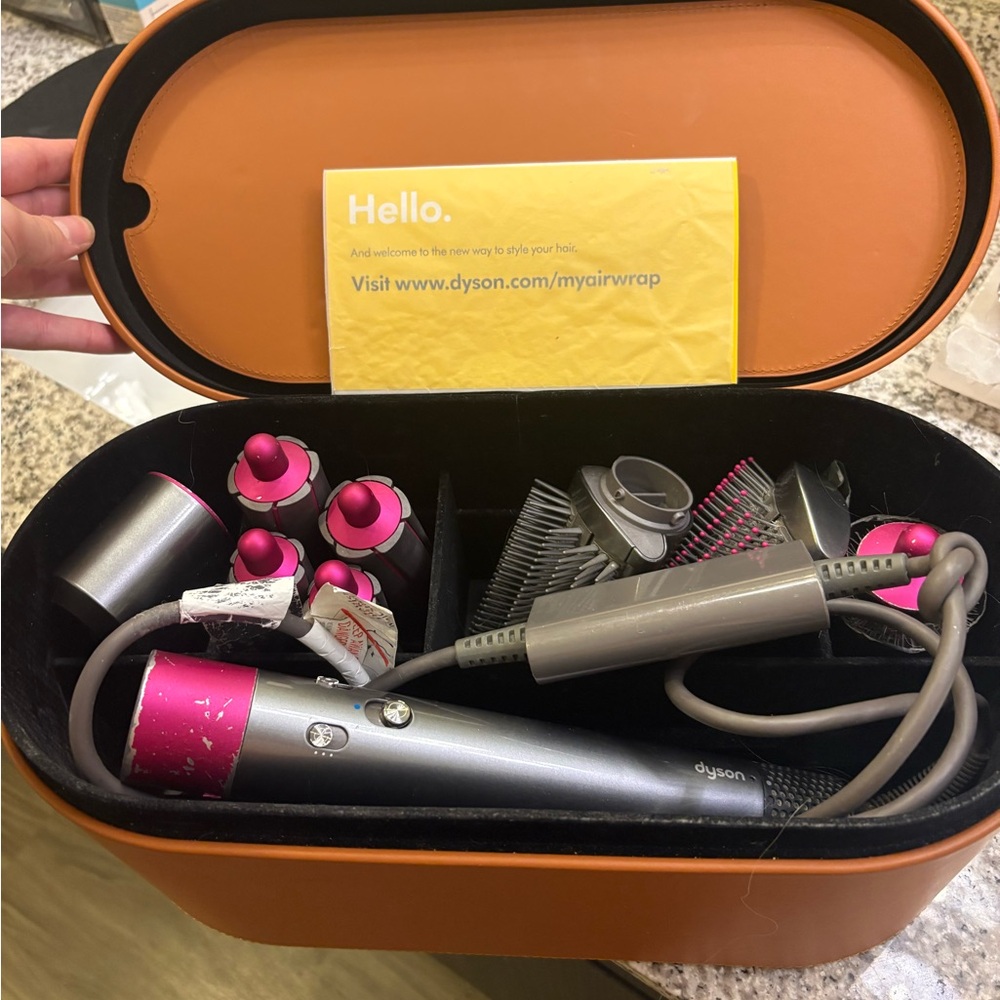 Dyson hair styler set in pink and gray with storage case